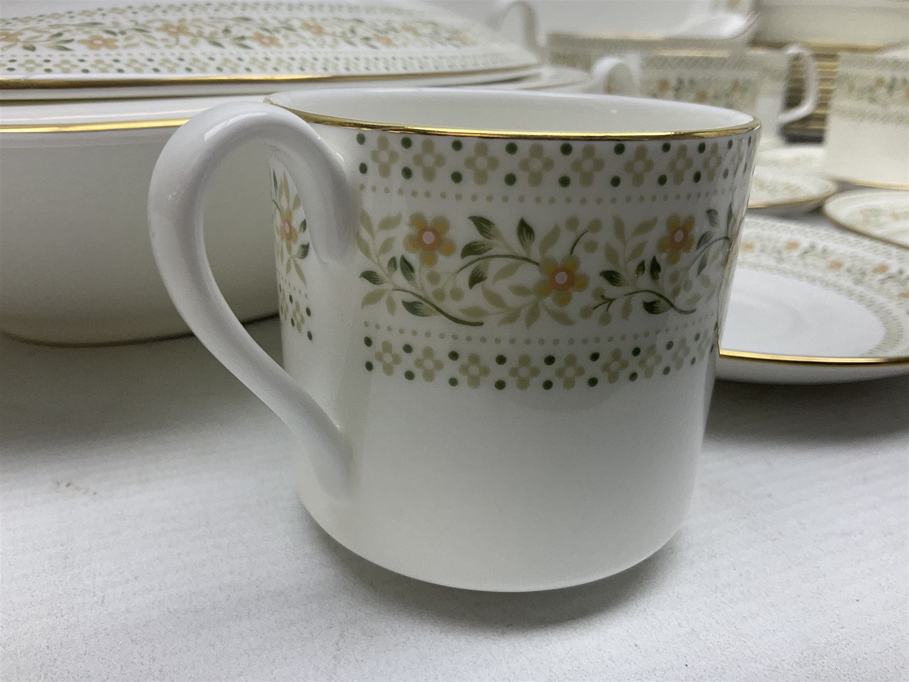 Royal Doulton Paisley pattern tea and dinner service for twelve, comprising dinner plates, side plates, soup bowls, dessert bowls, tea plates, two lidded tureens, sauce boat and saucer, sucrier and jug, oval serving dish and teacups and saucers