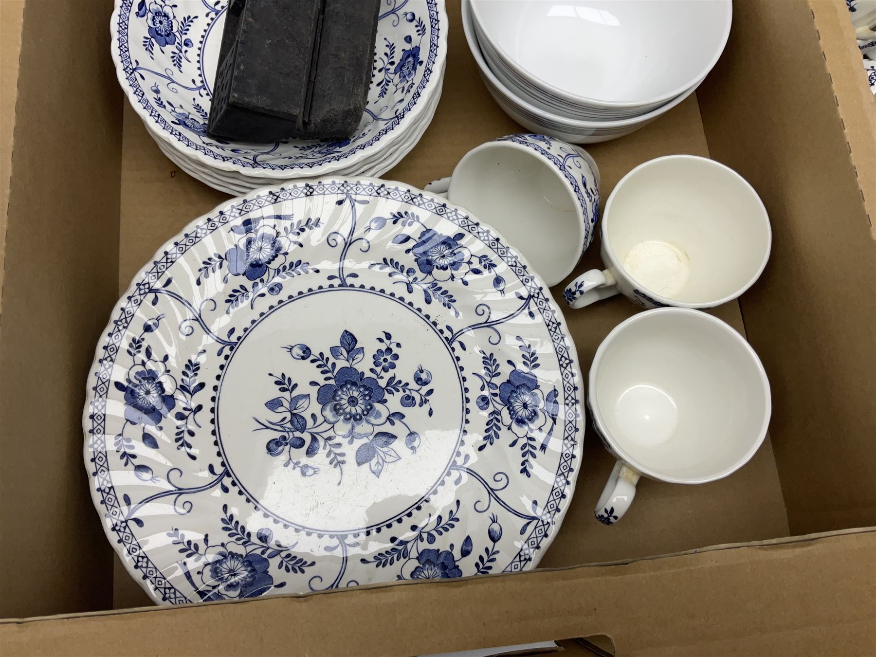 Johnson Bros Indies pattern tea and dinner wares, painted metal female bust on wooden plinth, three radios including one Roberts, Zenit B camera body, Polaroid 1000 land camera, Lorus wristwatch, and other ceramics etc, in four boxes