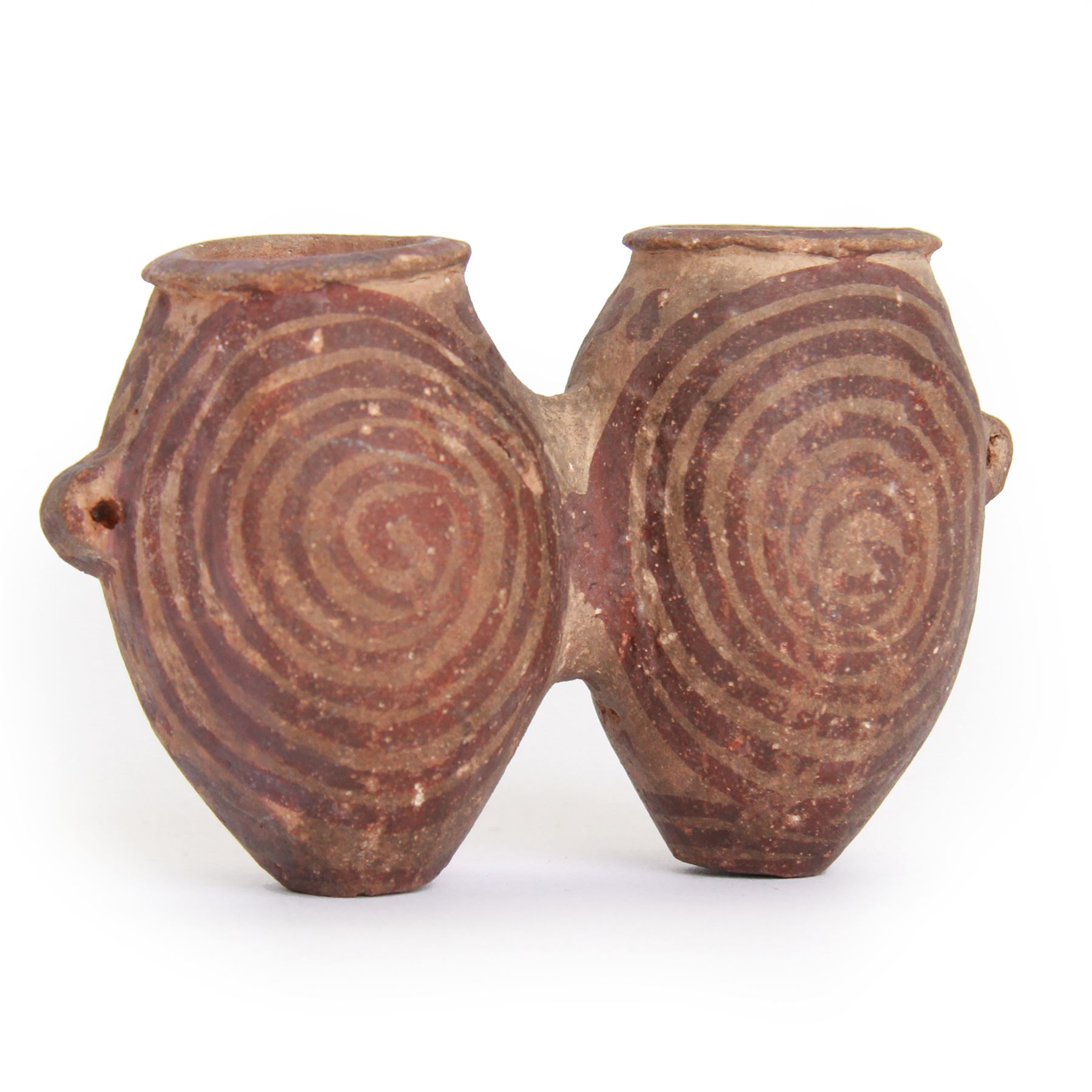 Miniature Egyptian pottery double-bodied jar, Predynastic Period, the two conjoined jars of ovoid form, each with pierced lug handle, and painted with spirals, tapering to flat bases, bearing Sotheby's label, H6cm W10cm
