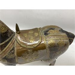 Wooden horse with a copper and brass saddle and decoration, H41cm 