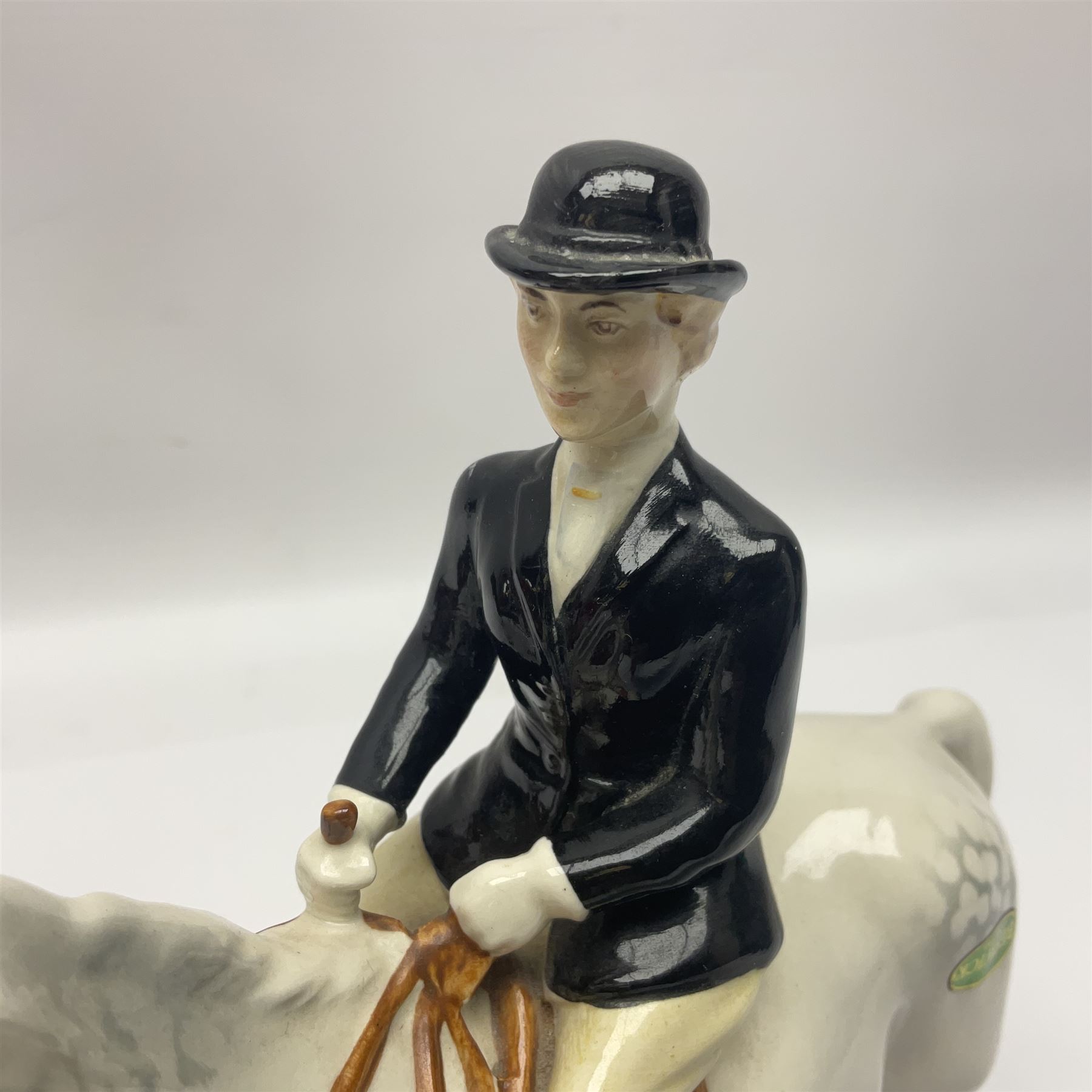 Beswick hunting group, comprising huntswoman on dappled grey horse no 1730, huntsman on bay horse no 1501, two fox figures no 1440 and 1748, and four fox hounds, all with printed marks beneath (8)