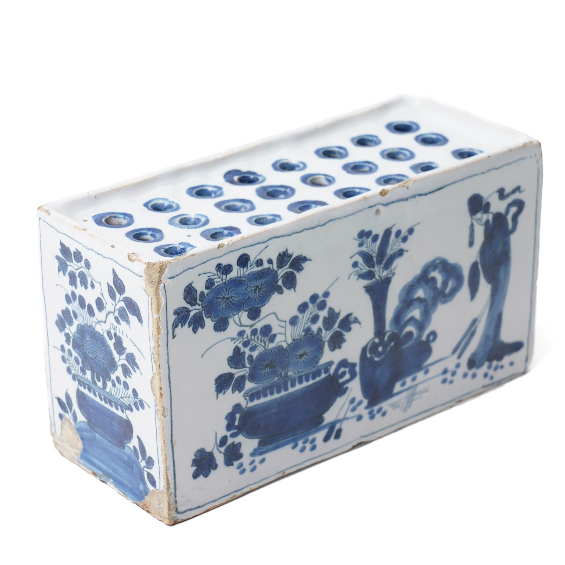 18th century English Delft flower brick, painted with a Chinese figure stood beside antiques, W16.5cm
