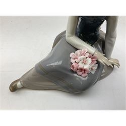 Four Lladro figures, comprising Afternoon Promenade no 7636, Nostalgia no 5071, both with original boxes, Girl with Lilies no 4972 and Madonna no 4534, largest example H27cm