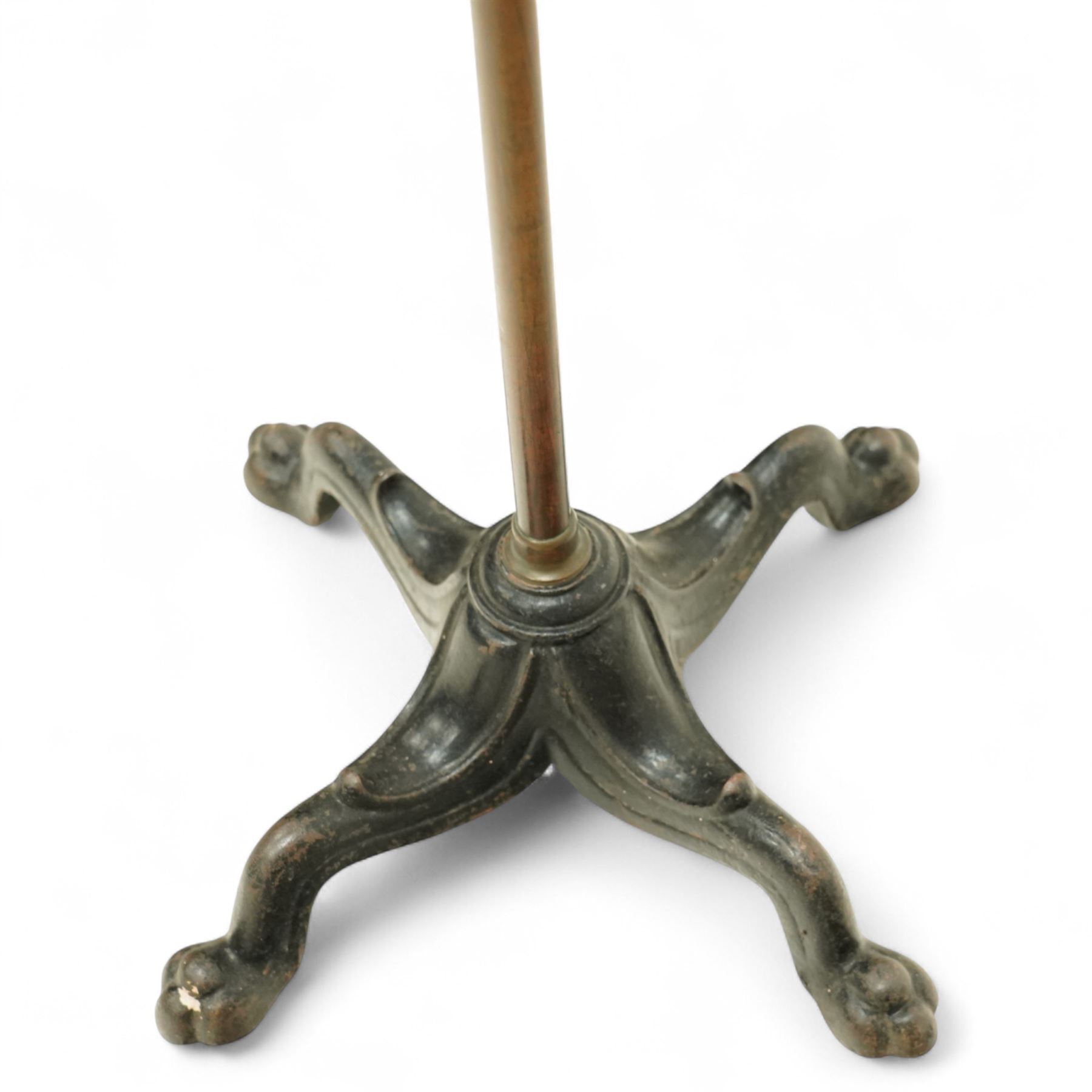 Victorian mahogany and brass adjustable music stand, tilting rest with edge, height adjustment mechanism to central column, supported on cast iron quadriform base