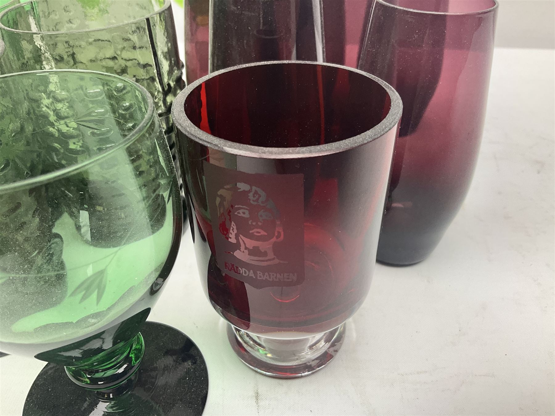 Set of four Swedish Reijmyre drinking glasses, with textured outer surface, together with green drinking glasses including Holmegaard examples and other glassware