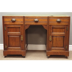  Edwardian walnut twin pedestal desk, three drawers and two panelled cupboards, W119cm, H77cm, D52cm  