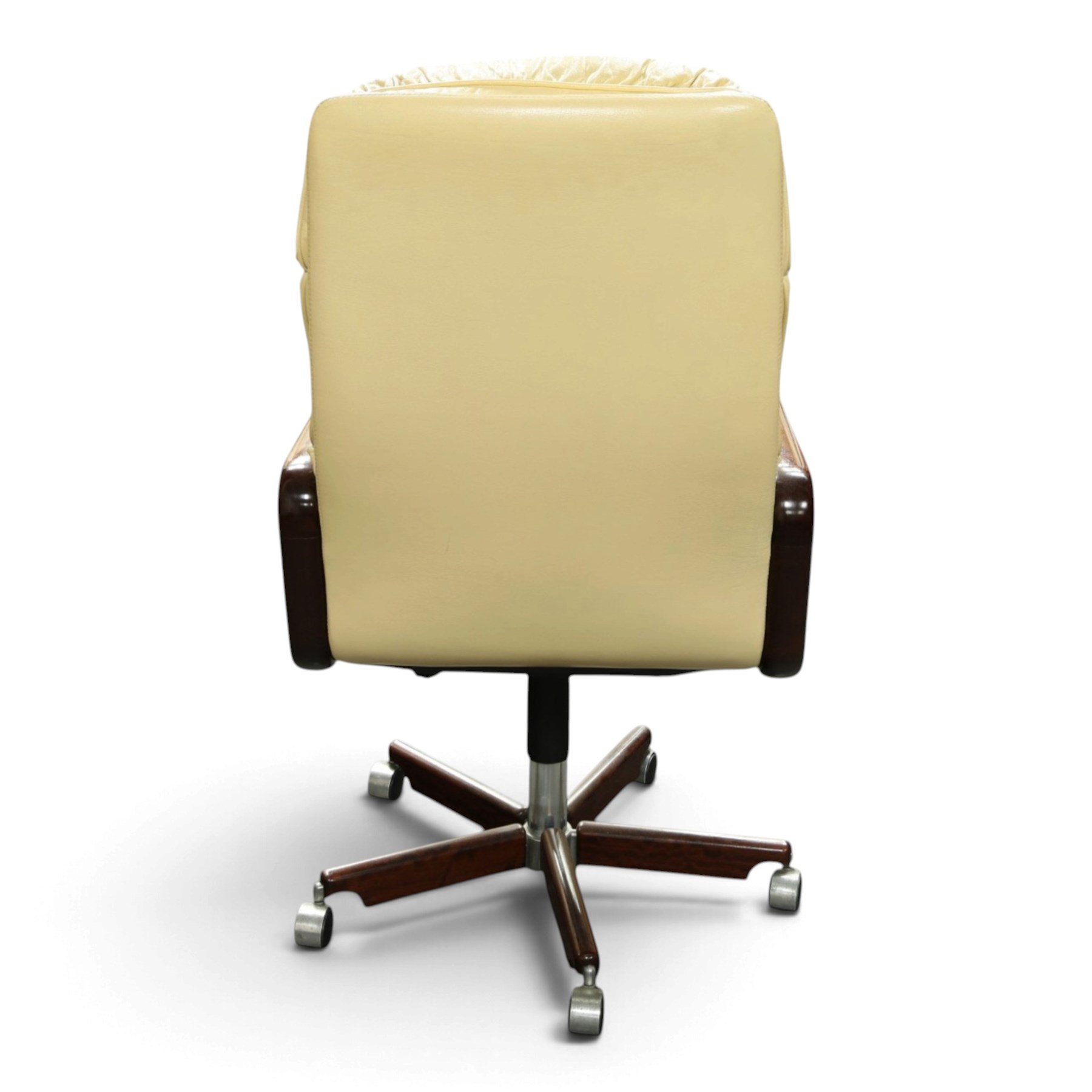 Dyrlund - Santos rosewood office suite, comprising an executive desk and cream leather upholstered swivel chair, the desk with a broad rectangular top with rounded corners, leather writing surface, pen compartments and letter tray, three lockable frieze drawers with fitted interiors above a central kneehole flanked by floating drawer pedestals, the left housing a filing drawer and the right three compartmented drawers, with a full width modesty panel to the reverse, chair raised on a castor base, H 116cm, W 62cm, D 74cm