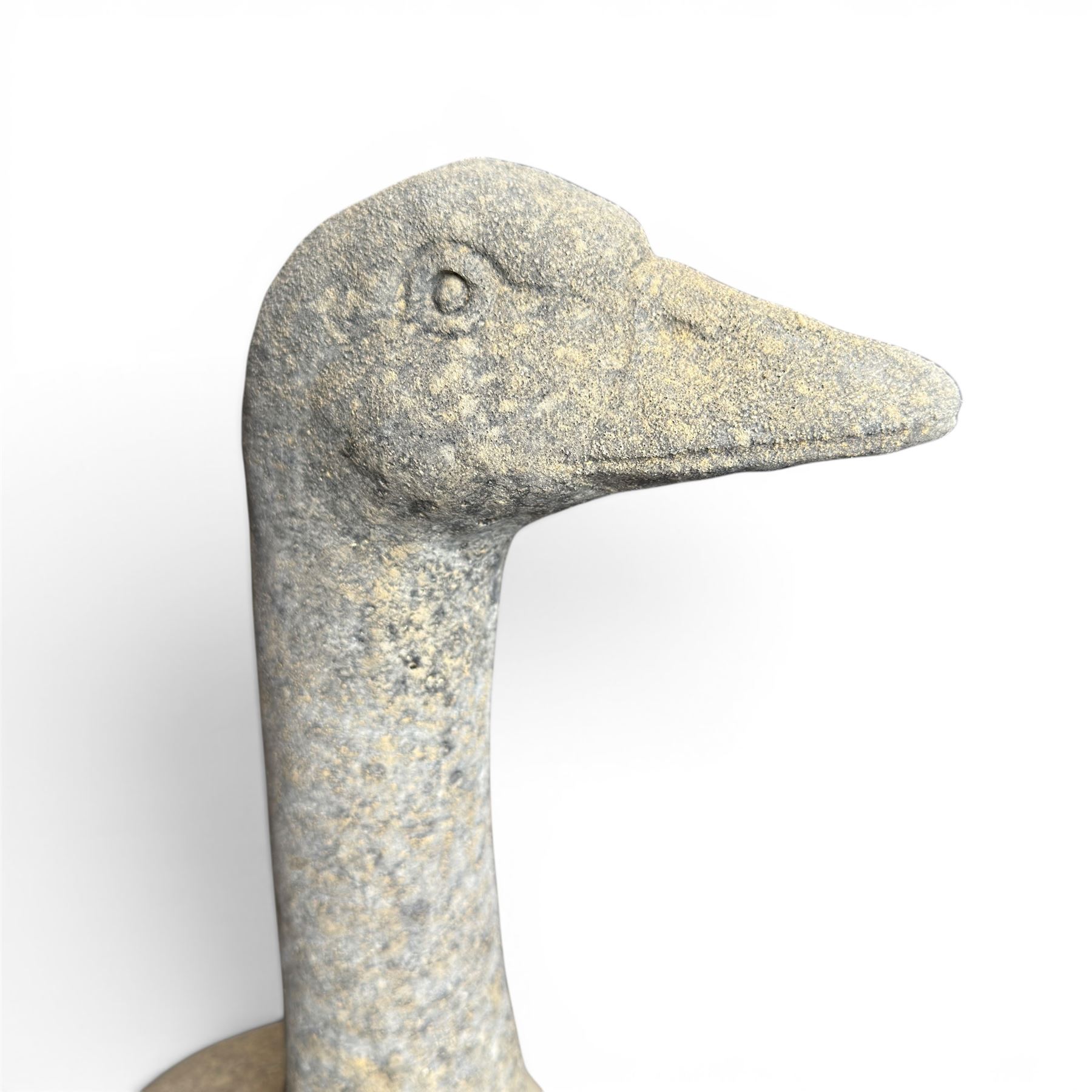 Large cast stone garden statue modelled as a standing goose on a naturalistic base