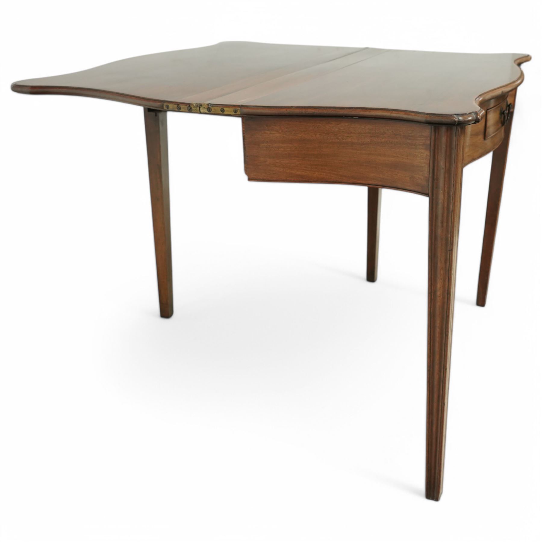 Georgian mahogany fold-over serpentine tea table, shaped rectangular top with drop leaves, fitted single drawer with brass handle, on squared tapering supports

Extended depth 90cm