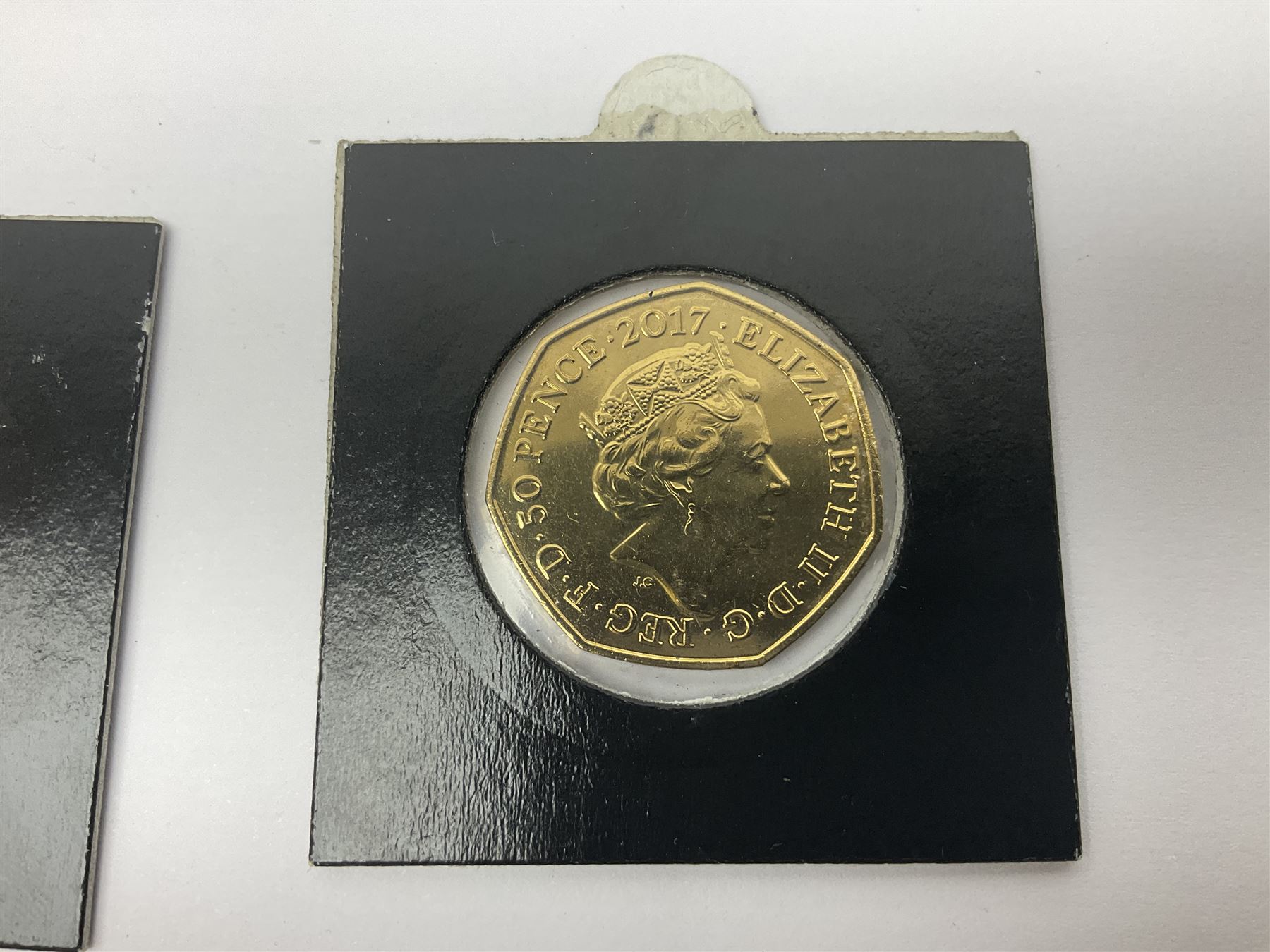 Four gold plated and coloured commemorative fifty pence coins, comprising 2017 Benjamin Bunny, Mr Jeremy Fisher, Tom Kitten and The Tale of Peter Rabbit, with Gold Strike certificate of authenticity