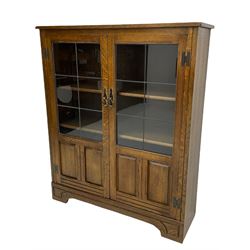 Medium oak display cabinet, fitted with two lead glazed doors