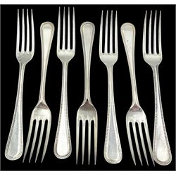 Modern silver Bead Edge pattern canteen, for six place settings, comprising dinner forks, dinner knives, side forks, side knives, soup spoons, dessert spoons, and teaspoons, plus four dessert forks, and a butter knife, hallmarked William Yates Ltd, Sheffield 1984, 1985, 1986 and 1987, approximate total weighable silver 82.65 ozt (2571 grams)

