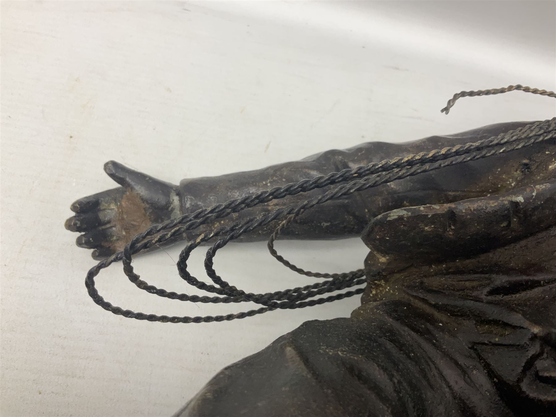 Early 20th century spelter effect figure of a sailor standing in the bow of a boat scanning the horizon, on a simulated rock base with a plaque entitled 'Rescue', base fitted with a timepiece clock movement and two-part dial, with pierced hands, gilt dial centre and ivorene chapter ring written in Arabic numerals, German HAC spring driven going barrel movement wound from the front; with pendulum H65.5cm
