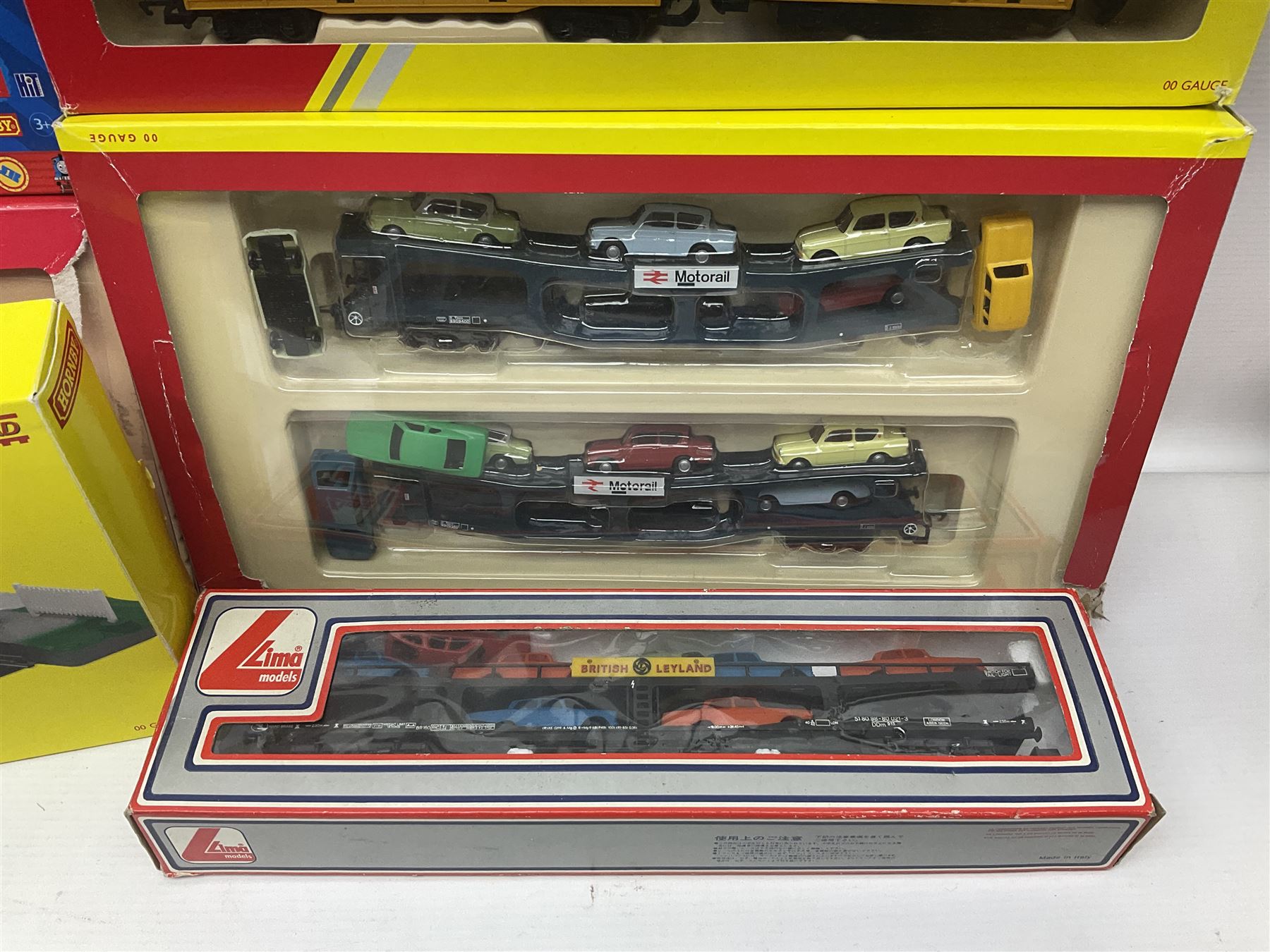 Hornby '00' gauge - Thomas the Tank Engine and Friends 0-6-0 tank locomotive No.1 with Annie and Clarabel coaches; all boxed; Breakdown Pack, Car Transporter Pack, Fuel Tanker Pack and Automatic Level Crossing; all boxed; Lima Car Transporter; boxed; and quantity of trackside accessories etc