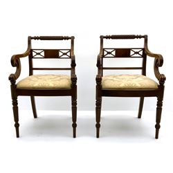 Set of fourteen Regency mahogany dining chairs, twelve side chairs with rope twist back rails above inlaid X rail, drop in upholstered seats, on turned legs, two matching carvers with hairy claw feet detail to lower arm
