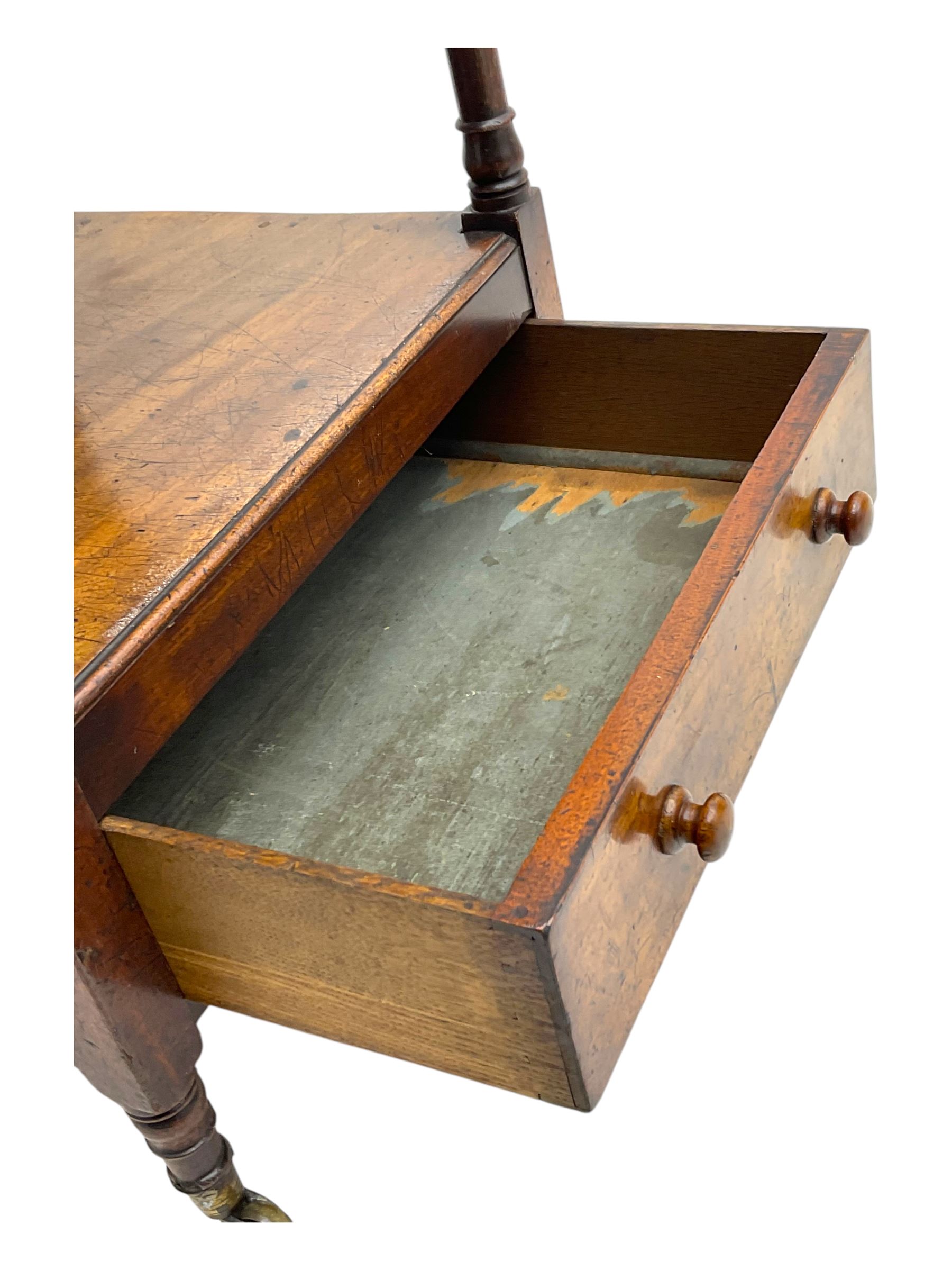 Early 19th century mahogany whatnot, with four rectangular shelves, the lower shelf fitted with a single drawer, supported by slender turned columns, raised on turned supports with brass castors