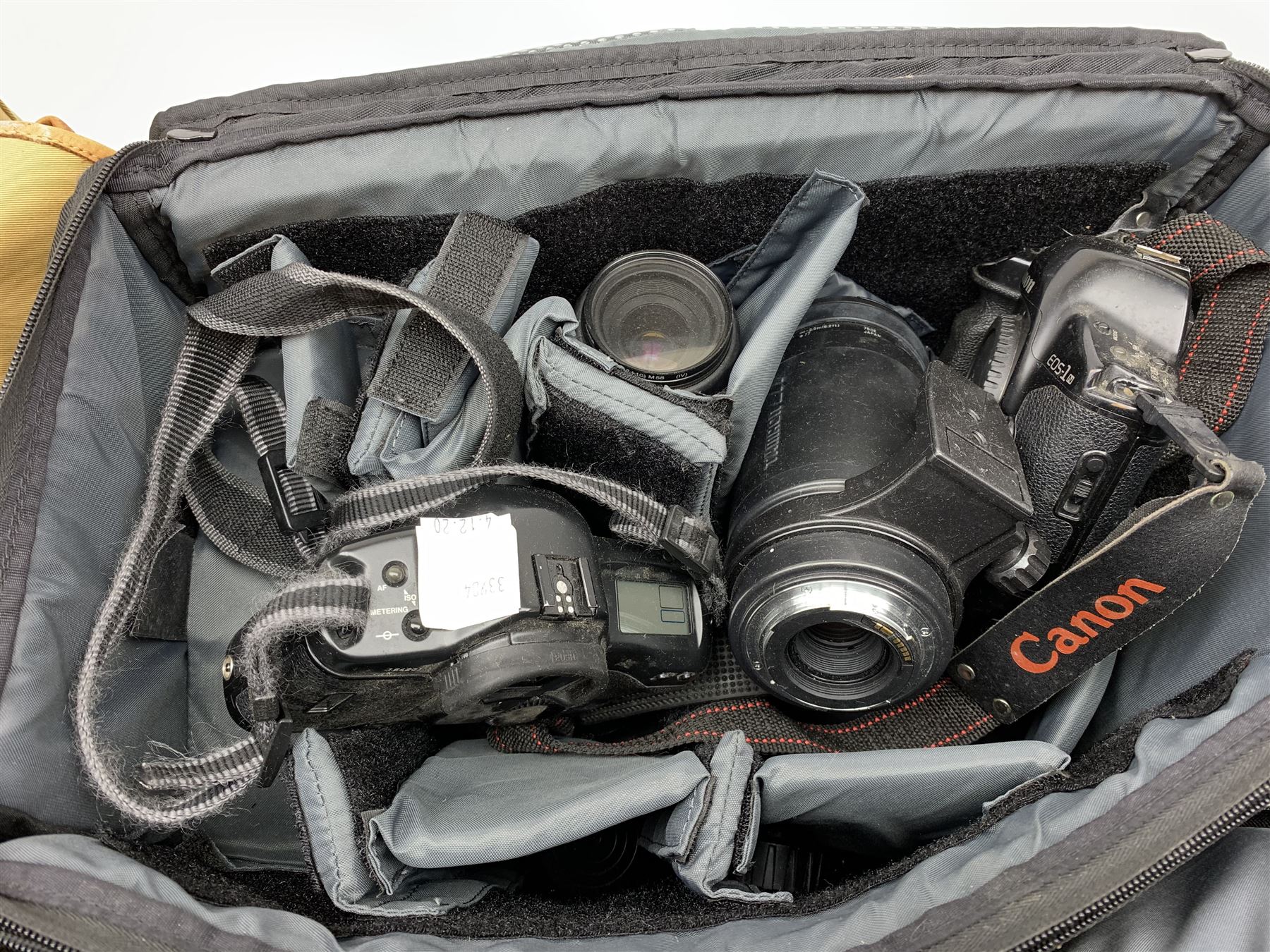 Canon EOS-1 camera body, Canon EOS-1N camera body, Tamron and Sigma camera lenses, two tripods, camera bags and various other accessories 