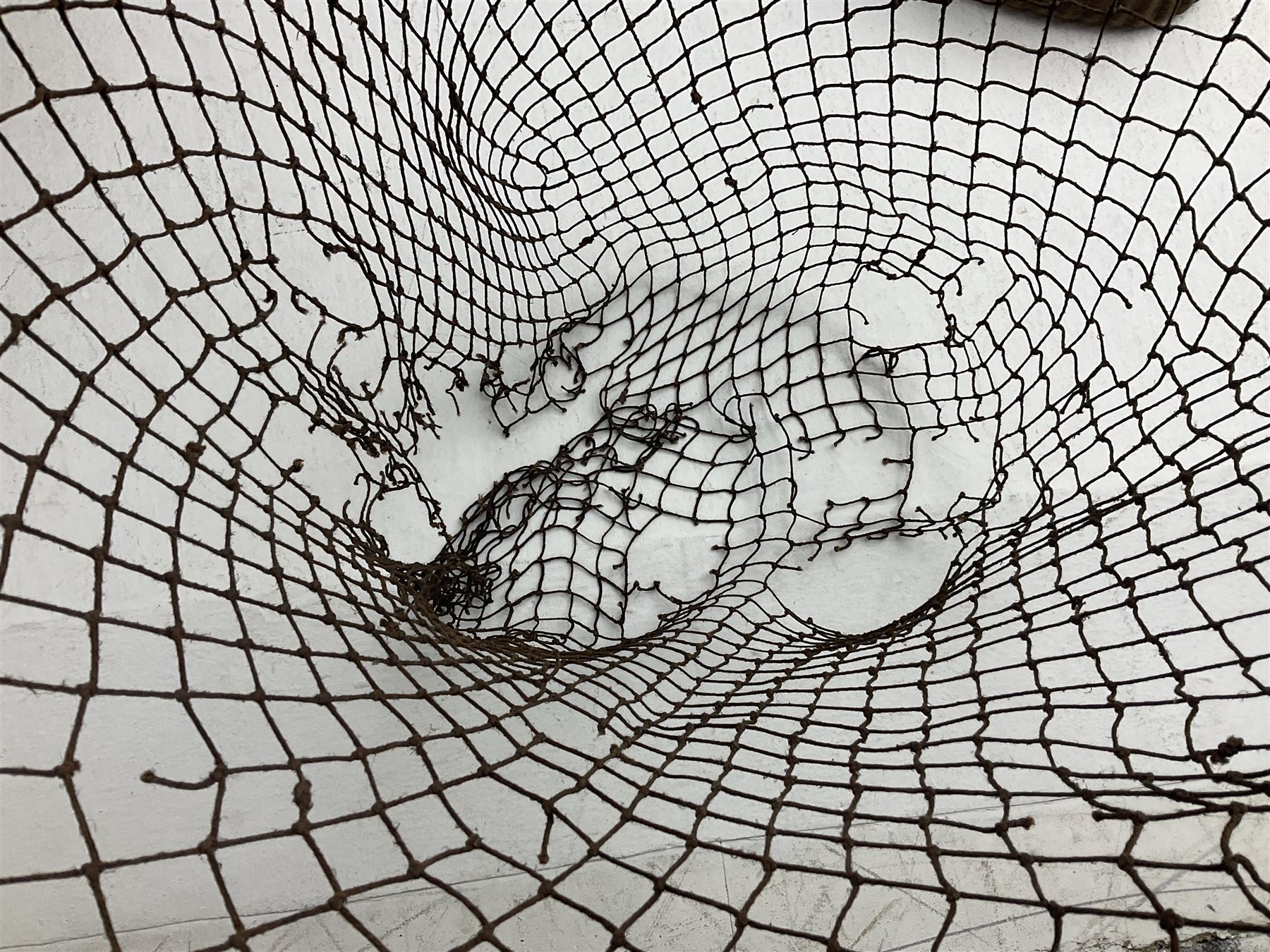 Fishing tackle and accessories housed in two wicker creels, including a landing net, fly tin, small brass reel, other reels to include two Intrepid Boy'o examples, crab lines etc 