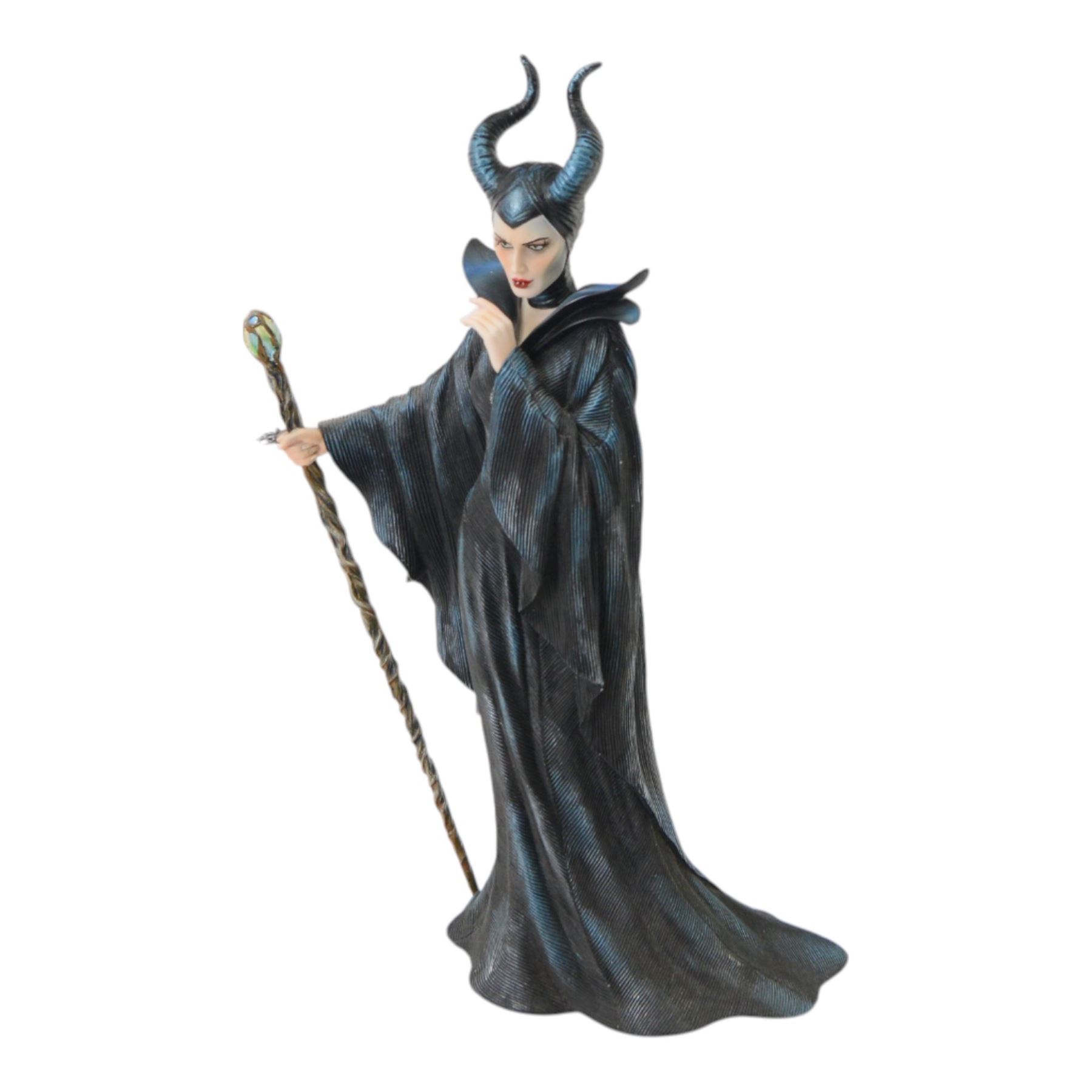 Disney Showcase Haute Couture figures, comprising Evil Queen, Cruella Devil and two Malificent, all boxed