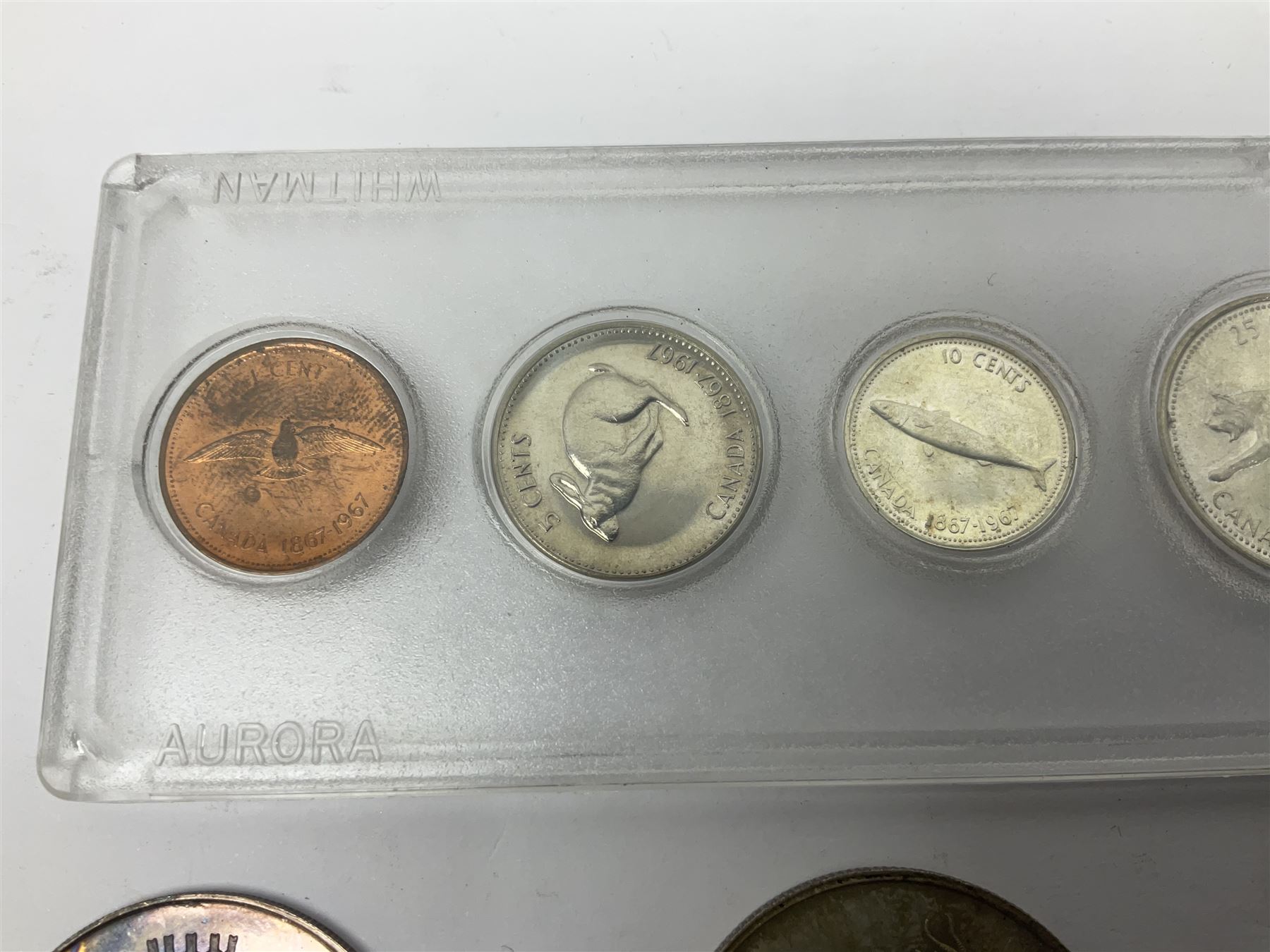 South Africa 1897 one shilling, 1967 one rand, Ireland 1928 two shillings and sixpence, Netherlands 1930 two and a half gulden, two Queen Elizabeth II Canada one dollar coins dated 1958 and 1964, 1967 six coin set in plastic holder etc