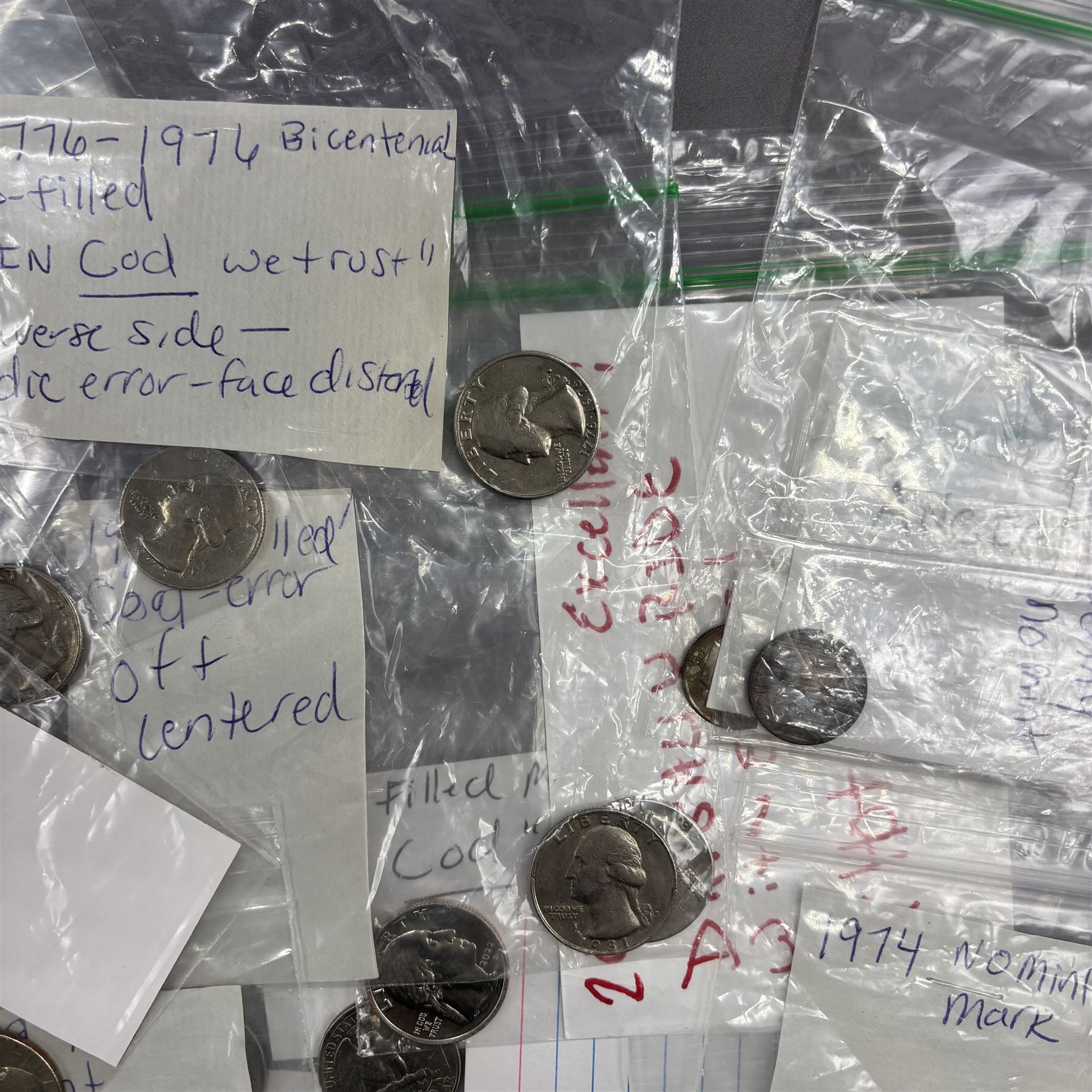 Collection of United States of America coins, 1965 onwards, principally quarter dollars, many with alleged minting errors as annotated on labels