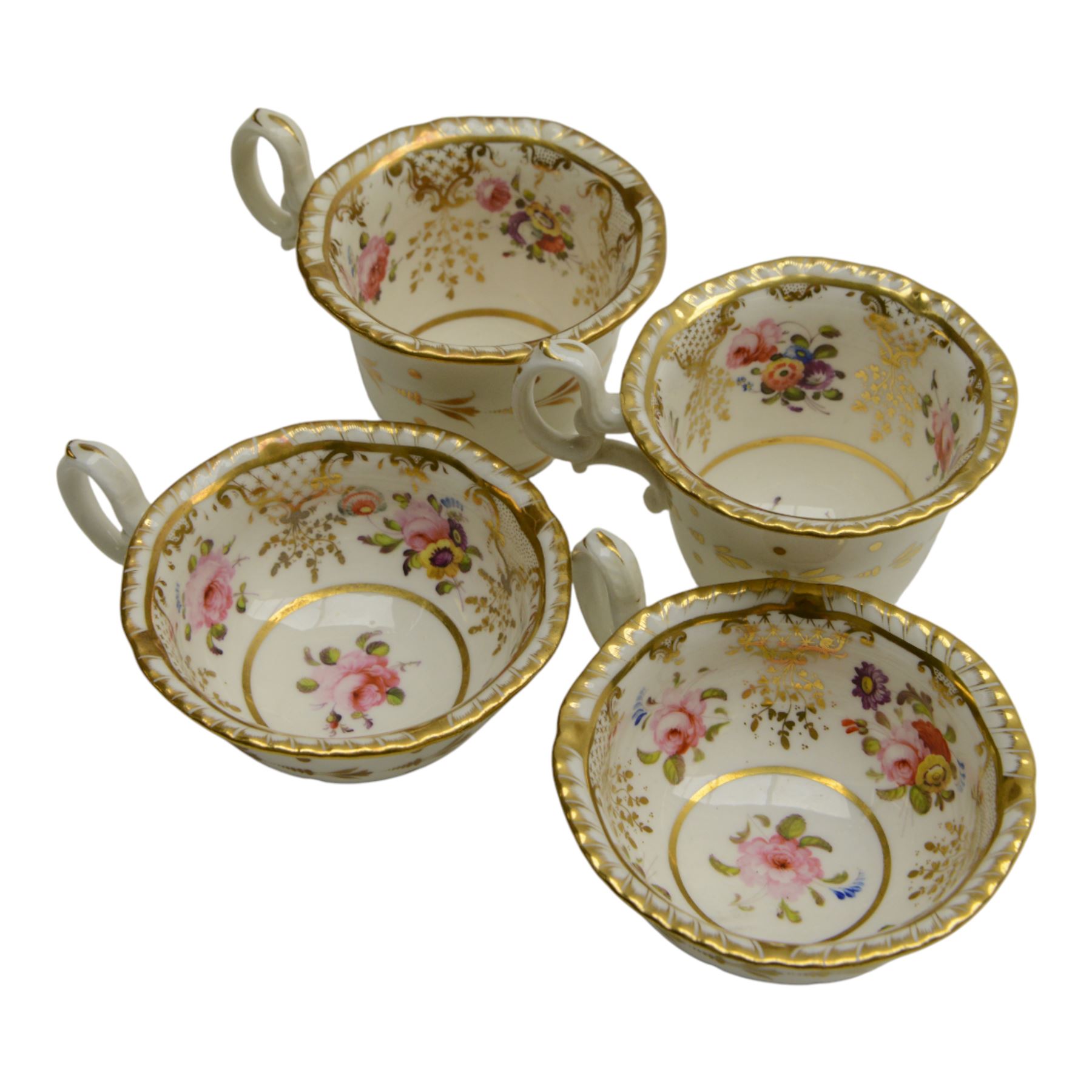 H&R Daniel, pair of trios, coffee cup, teacup and a saucer, circa 1826
pattern 4057, 'Second Gadroon Variation A', painted with fine foliate sprays and gilt hatched reserves, coffee cup including handle H8cm, saucer D14cm