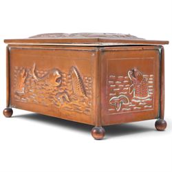 Art and Crafts copper and brass hammered casket, of rectangular form with repoussé decoration of dolphins, in the manner of  John Pearson, H10cm L19cm