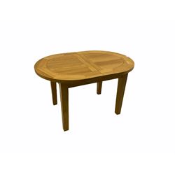 Solid oak oval extending dining table, butterfly leaf extension, four chairs with brown upholstered seats