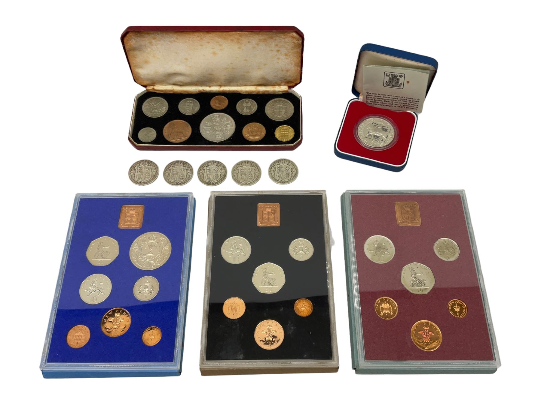 Four King George V 1915 and one 1916 silver halfcrown coins, Queen Elizabeth II cased 1953 ten coin set, 1977 silver proof crown and three Great British year sets dated 1977, 1978 and 1979