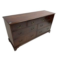 Georgian design mahogany chest, rectangular crossbanded top with stringing, fitted with seven assorted drawers with cock-beaded facias, on bracket feet