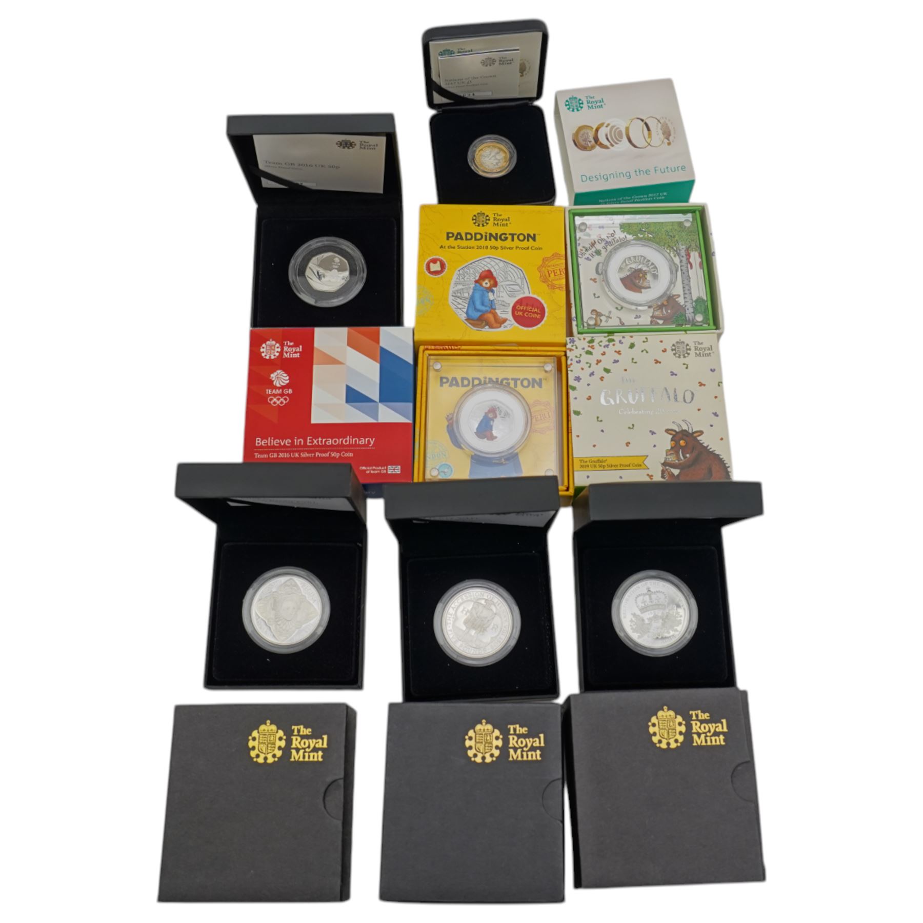 Seven The Royal Mint United Kingdom silver proof coins, comprising 2008 'Queen Elizabeth I' five pound, 2009 'Henry VIII' five pound, 2010 'Restoration of the Monarchy' five pound, 2016 'Team GB' fifty pence, 2017 'Nations of the Crown' one pound, 2018 'Paddington at the Station' fifty pence, and 2019 'The Gruffalo' fifty pence, all boxed with certificates