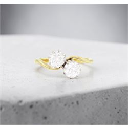 Gold diamond ring, crossover set with two old cut diamonds, stamped 18ct, total diamond weight approx 1.30 carat