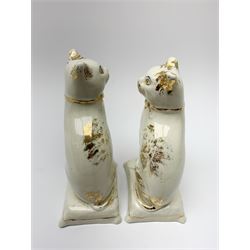 Pair of Victorian Staffordshire cats, modelled seated upon cushions, with gilt detail throughout, H18cm