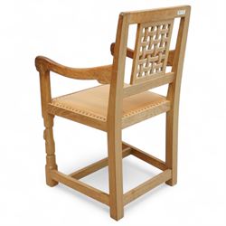 Mouseman - set of six oak dining chairs (5 + 1), pierced and carved lattice back over leather upholstered seat, on octagonal front supports united by stretchers, carved with mouse signature, by the workshop of Robert Thompson, Kilburn