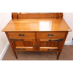  Harris Lebus Arts & Crafts oak sideboard, raised bevel edge mirror back, inset with Ruskin plaques in copper collars, moulded top above two drawers and two panelled cupboard doors with original metalware locks and keys, turned tapering supports, 'Rd 444345', W131cm, H149cm, D59cm  