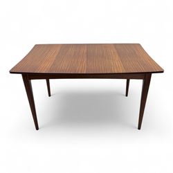 Richard Hornby for Fyne Ladye - mid-20th century afromosia teak dining table, tapered rectangular top with fluted edge and recess for spare leaf, raised on slender legs, teak framed chairs, of ladder back design, with drop-in seat, upholstered seat, with tapered front legs and slightly raked rear legs, retailed by Heals of London, table extended width 181cm depth 86cm height 74cm - chairs width 48cm depth 41cm height 87cm 