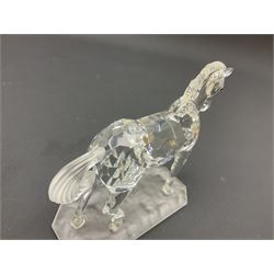 Five Swarovski Crystal horses, comprising stallion, rearing horse, pair of horses playing and Arabian stallion, each with frosted manes and tails, together with a small Swarovski Crystal galloping horse, the mane, tail and base with smoky tint