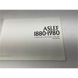 Black painted three colour railway lamp with revolving filters, H29cm; BR Acme Thunderer whistle; three railway peaked caps, two with BR Intercity 125 badge; small album of photographs of railway interest etc