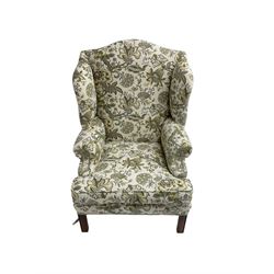 Georgian design wingback armchair, upholstered in Sanderson Mandalay fabric, on mahogany feet united by H stretcher