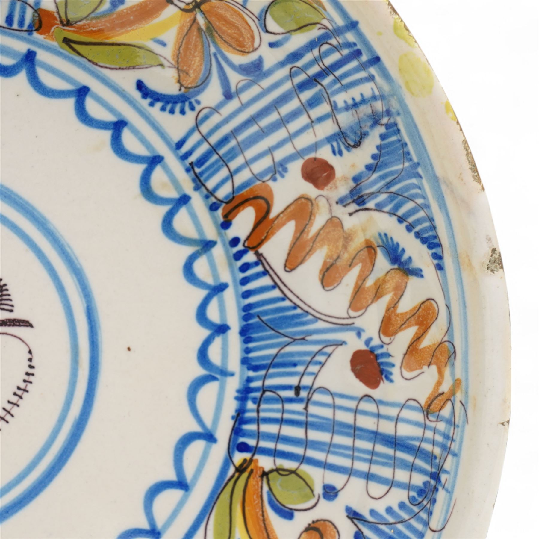 Spanish 18th century majolica bowl, possibly Talvera, decorated with orange flowers among blue decoration on a cream ground, D28cm 