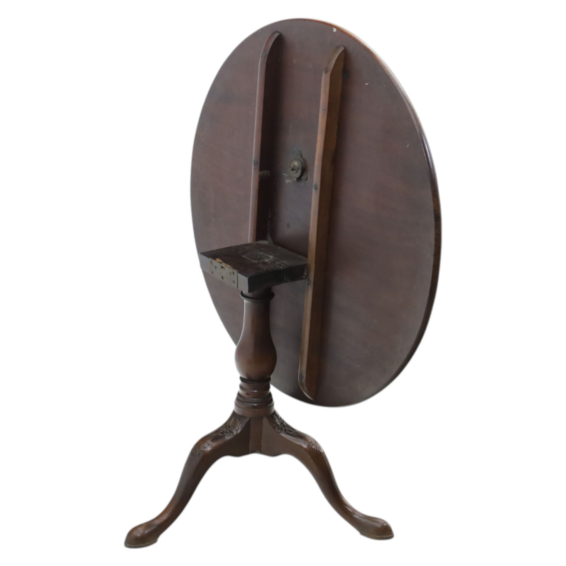 19th century quality mahogany tripod table, the circular tilt top supported on a turned baluster column with downswept cabriole legs carved with flower heads and terminating in pad feet