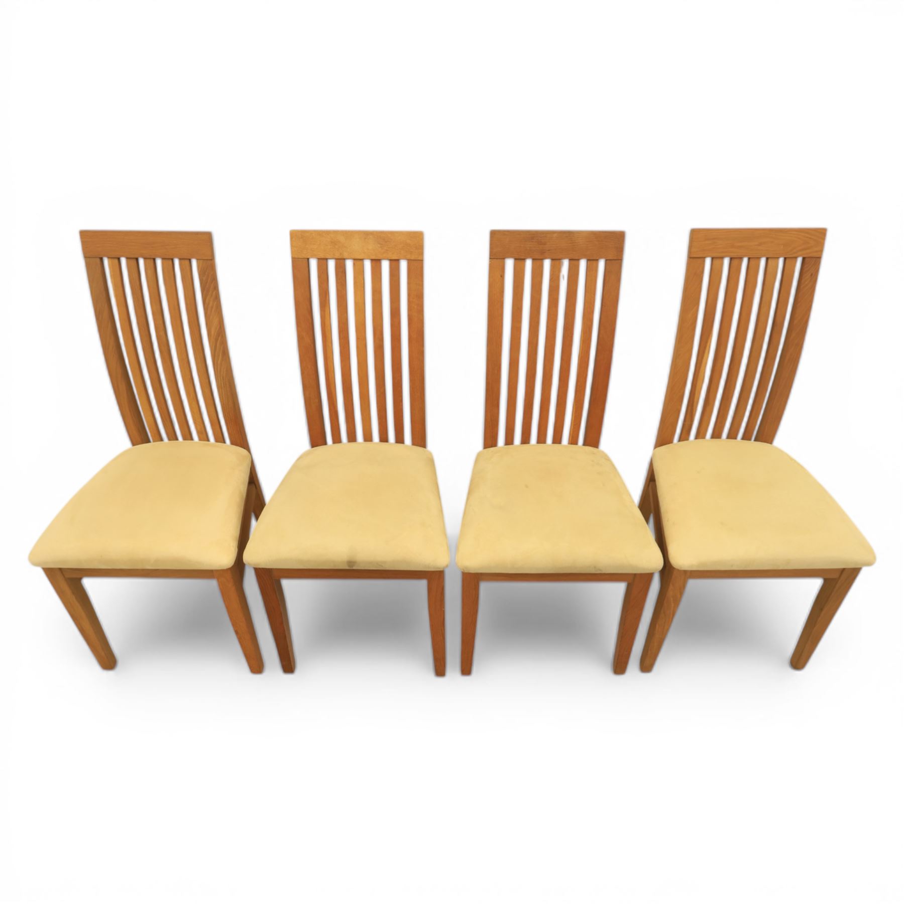 Contemporary teak dining suite comprising extending table and eight chairs, the table with rectangular plank top and one additional leaf extending to 210cm, supported on square tapering legs, the chairs with tall slatted backs and cream upholstered seats