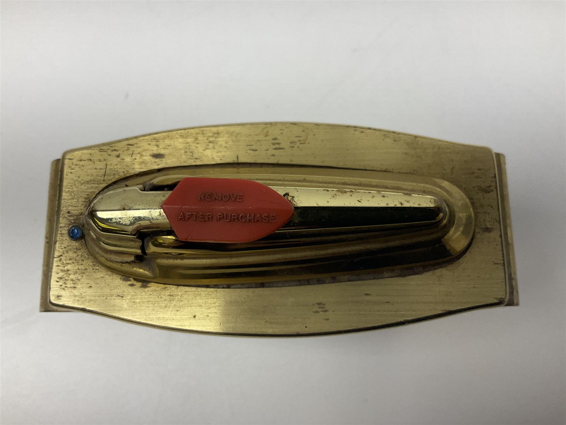 Ronson gilt metal table lighter, together with a silver-plate table lighter in the form of a football boot