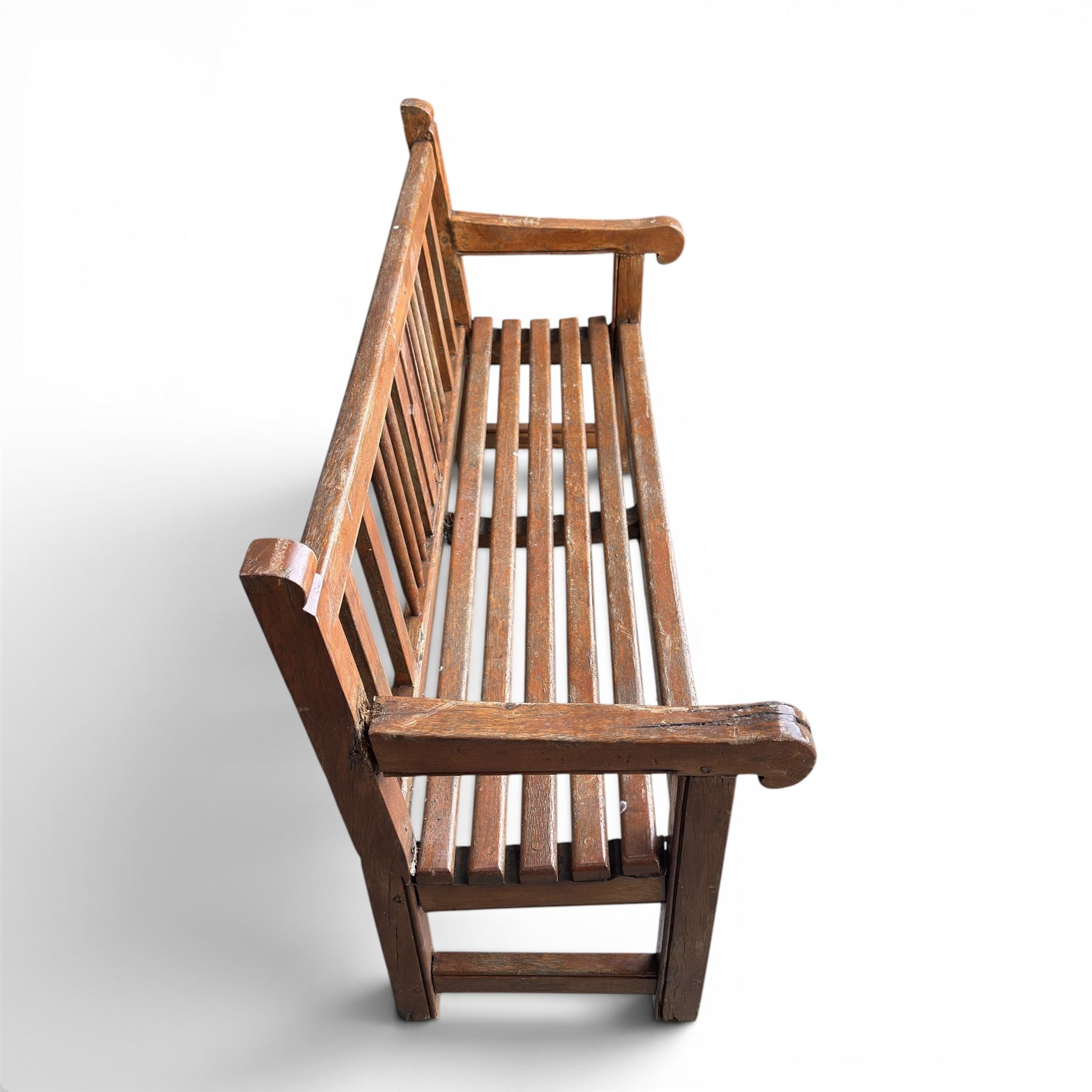 20th century teak cricket bench featuring a central splat with moulded cricket bat and ball motif flanked by stylised wicket spindles, over a slatted seat and square supports