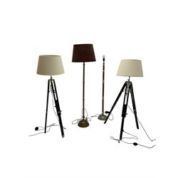 Pair 20th century standard lamps on Theodolite tripod base; and two standard lamps one with rope twist support (4)