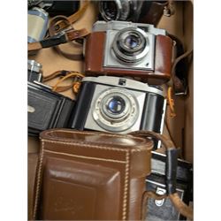 Collection of vintage cameras, including Zeiss Ikon, Canon Canonet, Ensign, etc
