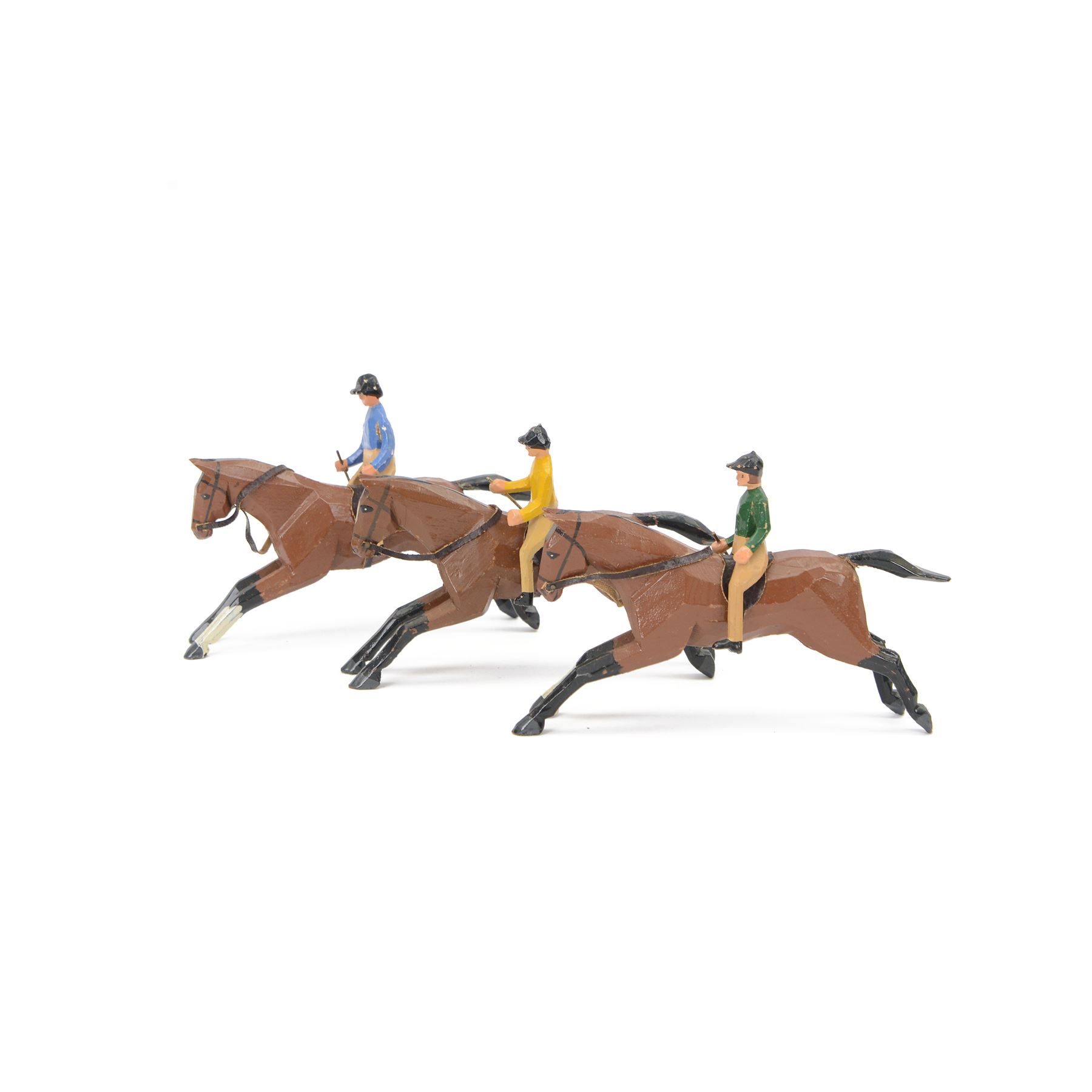 Three early-mid 20th century carved and painted wooden jockeys on horseback, attributed to Frank Whittington of Forest Toys, Brokenhurst