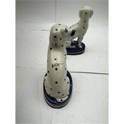 Pair of Staffordshire figures modelled as chained Dalmatians seated upon cobalt blue oval bases, H13cm, together with a Staffordshire pastille burner modelled as a castle, H12cm, a pair of 19th century Derby potpourri pots (lacking covers), and an 18th century blue and white tea bowl 