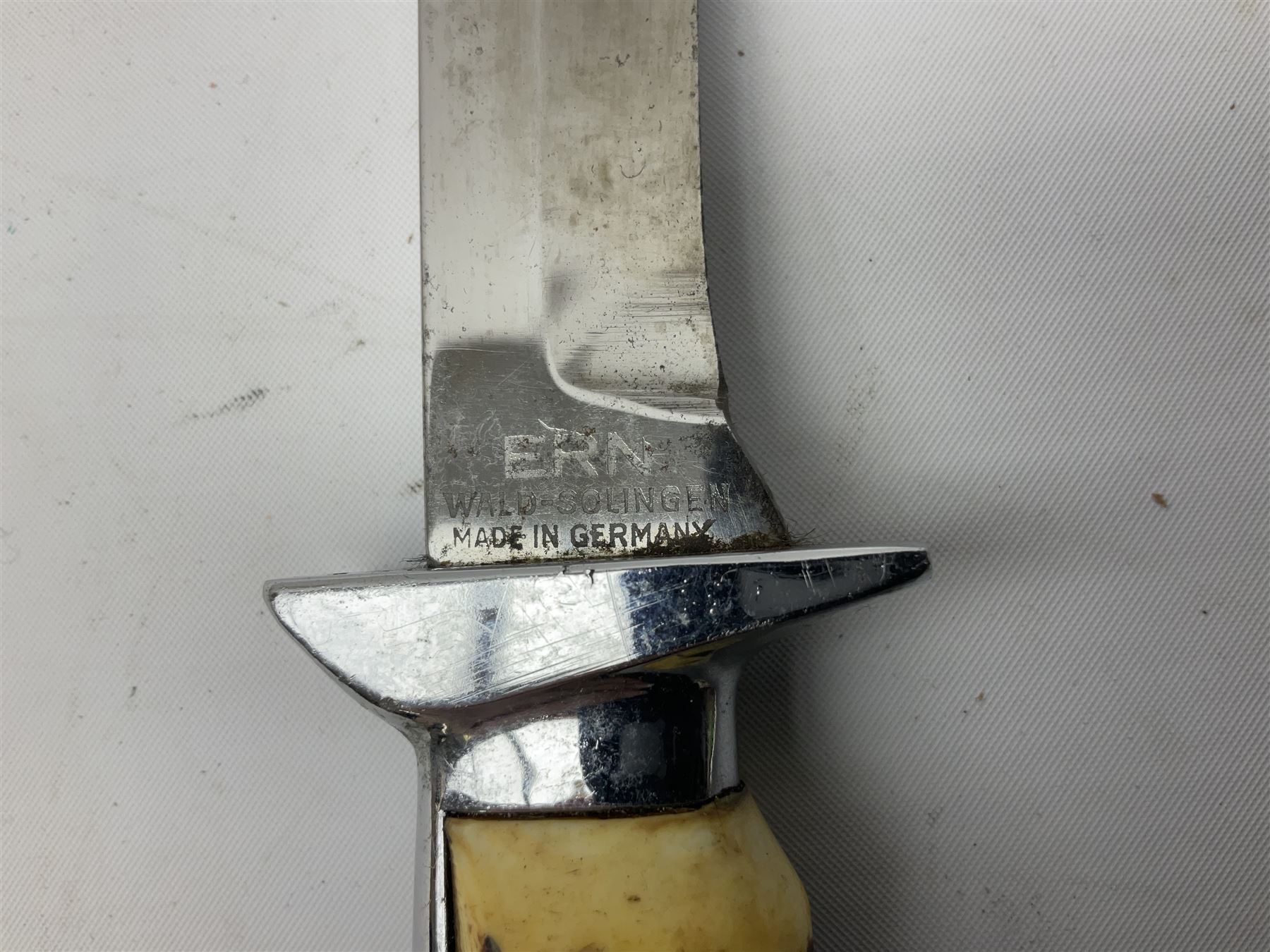 German ERN Wald-Solingen Art Deco style hunting knife with 13cm Bowie type blade and chrome fittings with antler grip; in leather sheath L24.5cm overall; and Bianchi Rastignano Aeronautica Militare combat knife with 15.5cm Bowie type saw-back blade and stacked leather grip (2)