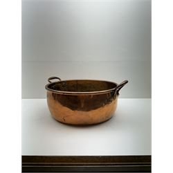 Large copper twin handled pan, together with copper measures, jugs etc, pan D40cm 